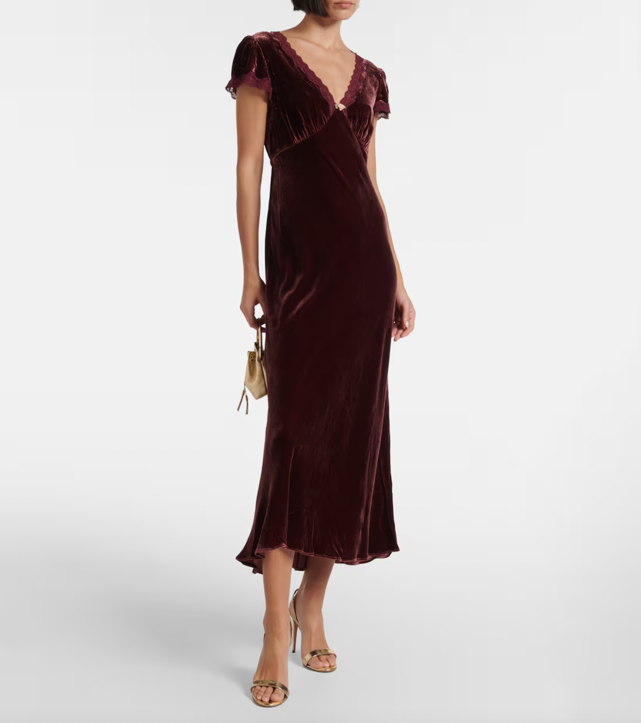 Indulge in luxury with the Clarice Dress, a perfect party-ready midi dress. Crafted from smooth velvet and delicate silk, this dress exudes elegance and softness. With its sophisticated design, you'll be the center of attention at any event.