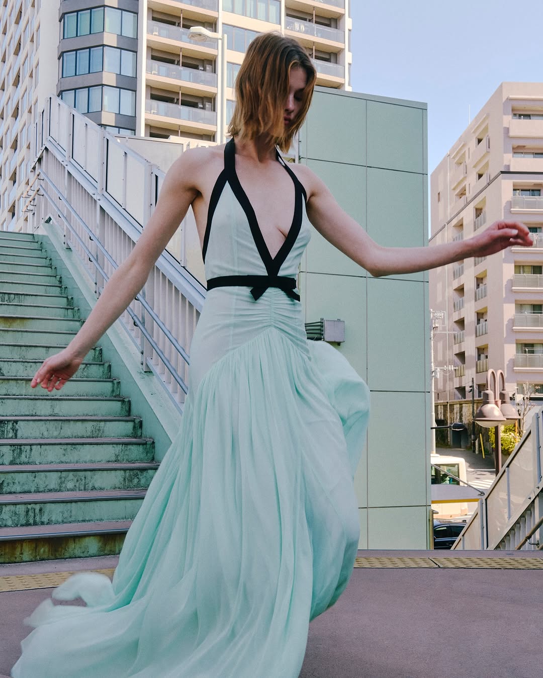 The Siren Dress in Mint by Helsa is engineered for those who embrace bold fashion statements. This sleeveless bodycon maxi features a striking plunging V-neckline and open back that exude confidence and allure. Contrast mesh patchwork adds contemporary visual interest, while pleated skirt detailing creates graceful movement. The secure halter construction delivers support without compromising the dress's daring aesthetic. 