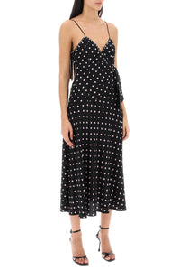 This high-quality designer slip dress, adorned with a playful polka dot print and finished with a delicate bow, is a top-of-the-line addition to any wardrobe. Handmade by industry experts, this Alessandra Rich dress offers a slinky, sophisticated silhouette perfect for any occasion.