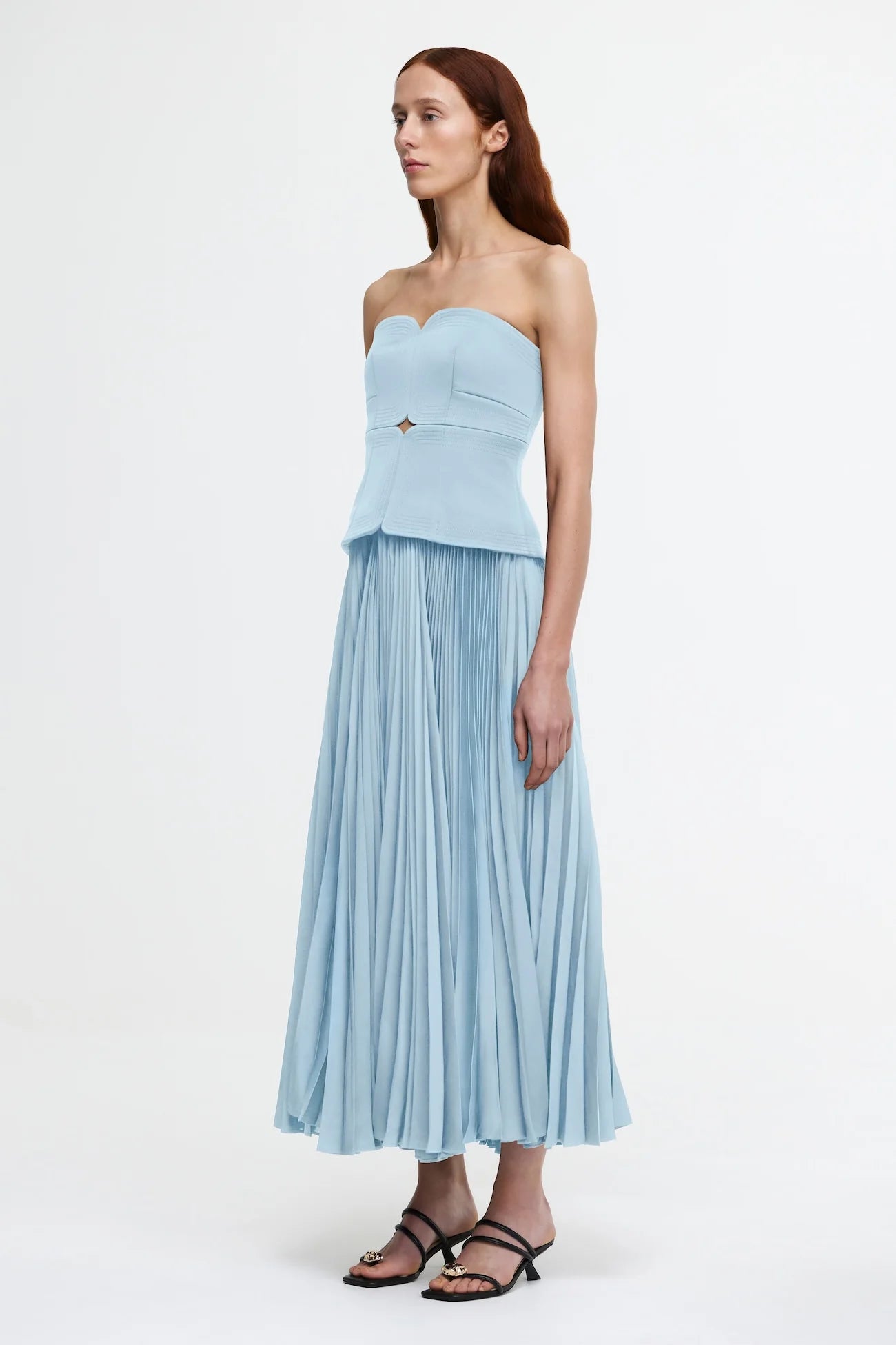 Introducing the Avonlea Dress by ACLER - a modern interpretation of the timeless Acler silhouette. Crafted in Celeste Blue, this midi dress boasts a structured bodice and square neckline, perfectly complementing the signature pleated fabric for a feminine, flowing look. Elevate your style with this exclusive piece.