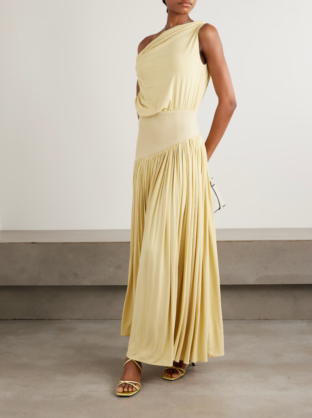 Discover effortless elegance with the Gwen Asymmetric Draped Jersey Dress by Abadia. Crafted from luxuriously soft stretch-bamboo fabric, this stunning piece features a sophisticated one-shoulder design that flatters every frame. Artfully draped details flow gracefully from the fitted top through the skirt, creating a silhouette that's both modern and timelessly chic. 