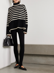 This striped wool-blend turtleneck sweater from TOTEME combines timeless style with cozy comfort. Crafted from a soft blend of wool and organic cotton, it features a relaxed fit and a classic turtleneck, making it perfect for layering. The iconic stripes add a refined touch, while the breathable fabric ensures warmth without bulk. Pair it with tailored pants for an effortlessly polished look that lasts season after season.