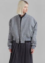 Load image into Gallery viewer, Introducing the Debbie Wool Bomber Jacket by The Frankie Shop, crafted from luxurious midweight woven wool. With a relaxed fit and cropped profile, it exudes an elegant and exclusive style. The ribbed baseball collar, front welted pockets, and elasticated ribbed trim add both sophistication and functionality. Snap up the front button closure for a timeless and tailored look.
