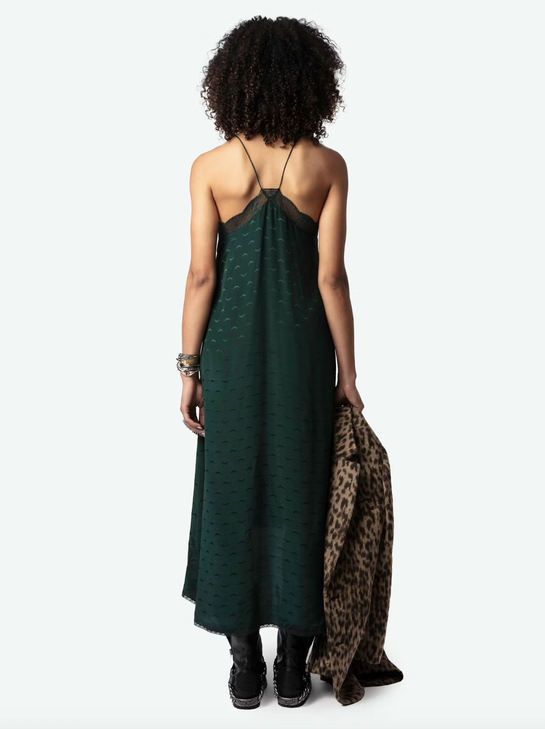 Experience ultimate luxury in the Risty Wings Silk Jacquard Dress by Zadig & Voltaire. Made from the finest Peaks dark green silk, this lingerie-style maxi dress features a delicate jacquard wings design and lace strips. The v-neckline, thin non-adjustable straps, and asymmetrical bottom add an alluring touch.