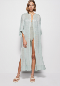 Get ready to hit the beach in style with our Coverup Odelia Maxi! Featuring a stunning seafoam color and made from high-quality material, this coverup will make you stand out on the sand. Made by Jonathan Simkhai, our maxi provides both style and comfort for all your seaside adventures.