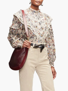 Step into the free-spirited 70s with the Reign Ruffled Paisley-Print Blouse! Adopted by icons like Janis Joplin and Jimi Hendrix, this Isabel Marant Étoile blouse exudes bohemian charm with its multicoloured paisley pattern. Lightweight poplin and delicate lace-trimmed ruffles add a feminine touch. Pair with tailored trousers for a stylish contrast.