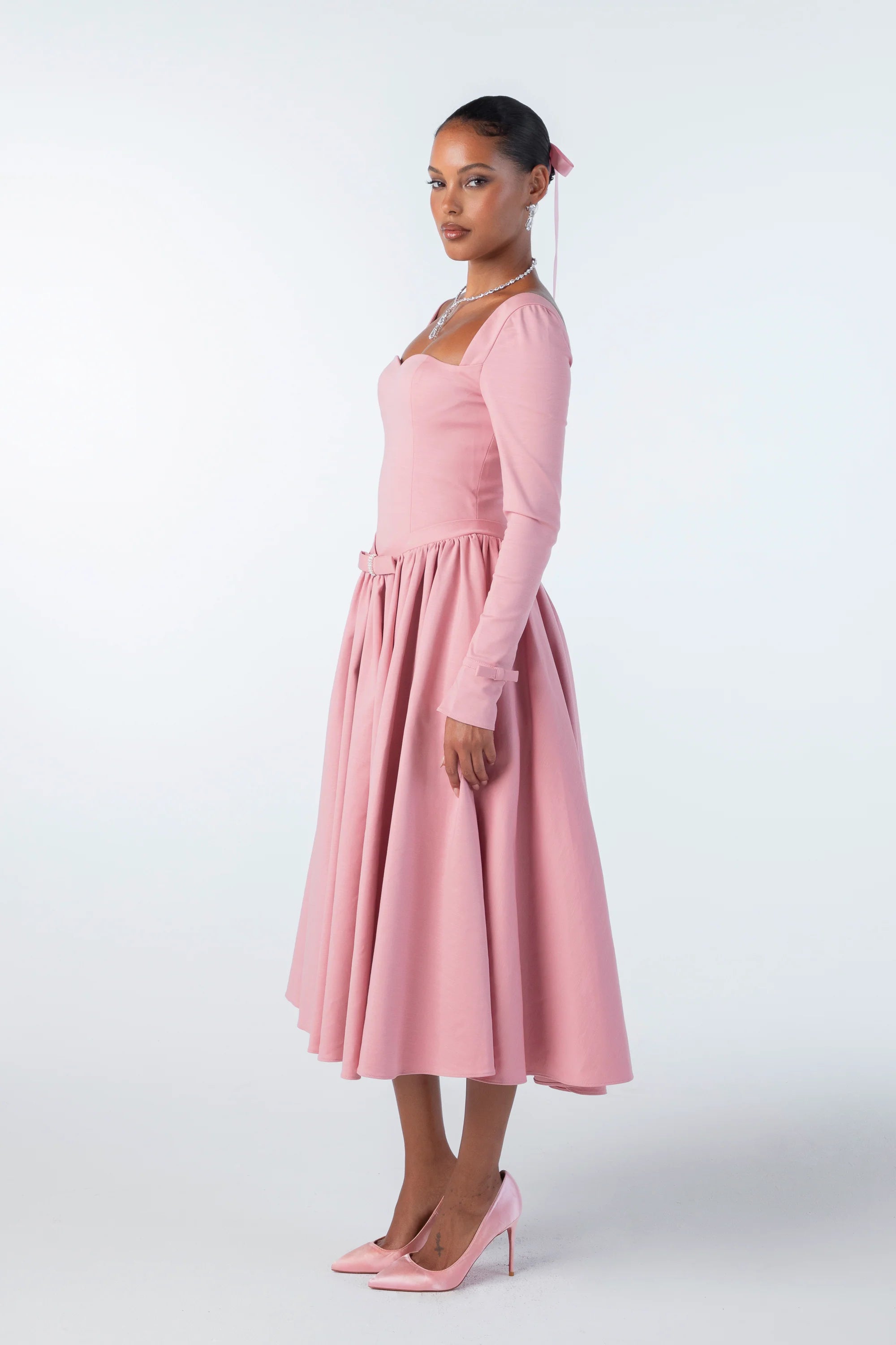 Indulge in luxury with the Bernadette Midi Dress. Meticulously crafted from double-layer fabric, this dress offers the perfect balance of elegance and functionality. Its thickness and elasticity ensure a flawless fit, while its sleek silhouette exudes sophistication. Elevate your wardrobe with this essential piece.