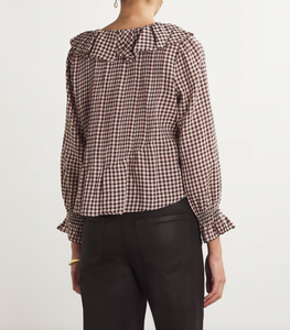 Embrace bohemian style with the Hardy blouse from Dôen. Made with organic cotton voile, this ruffled top features a playful plaid print for a touch of nostalgia. Perfect for a casual, retro-inspired look.