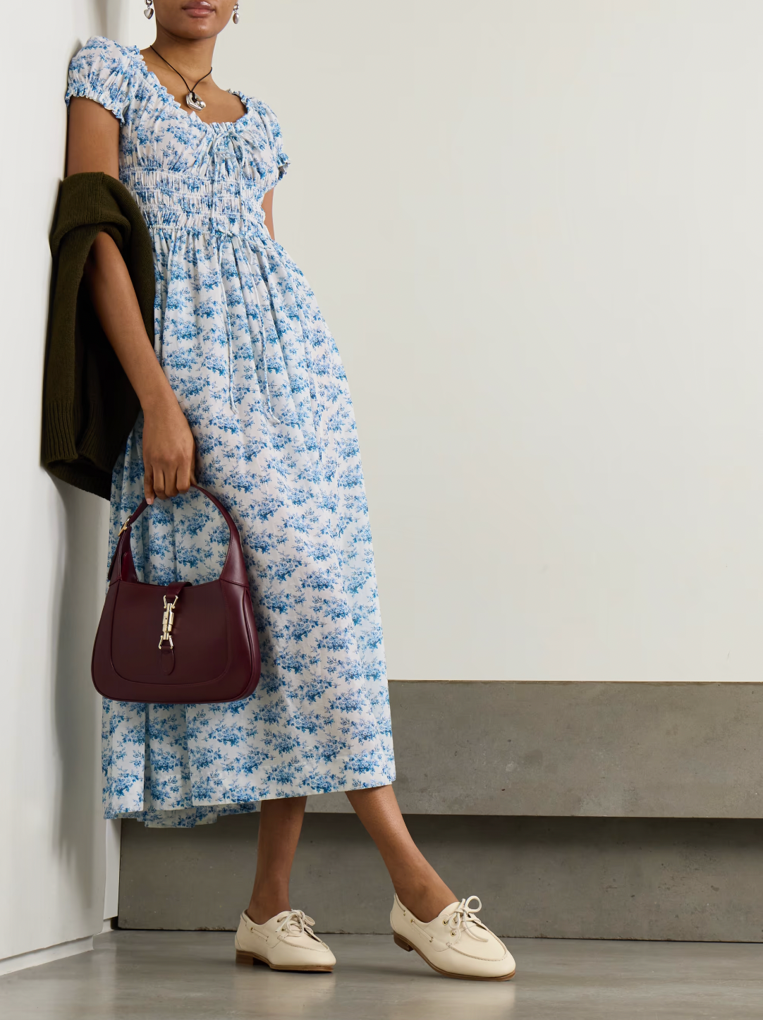 Experience effortless romance with the Ashlynn midi dress by DÔEN. Crafted from breathable organic cotton-voile, its all-over floral print captures a timeless, delicate charm. The shirred bodice offers a comfortable fit, while adjustable ties at the neckline and waist allow you to tailor the silhouette to your liking. Perfect for warm days and graceful evenings, this dress brings Southern Californian ease to your wardrobe with eco-friendly elegance.