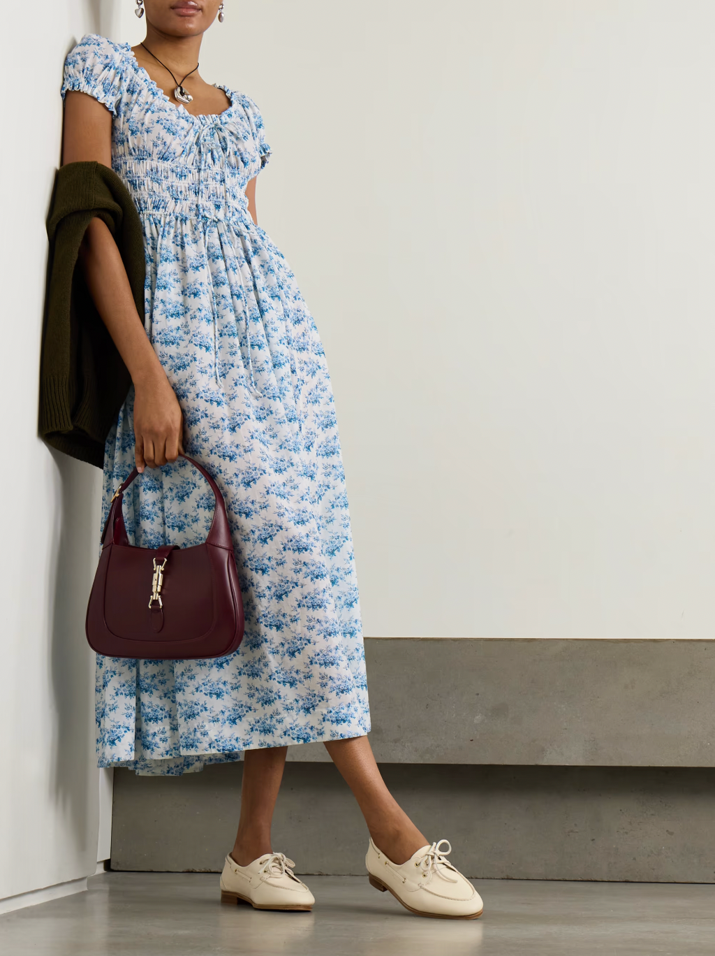 Experience effortless romance with the Ashlynn midi dress by DÔEN. Crafted from breathable organic cotton-voile, its all-over floral print captures a timeless, delicate charm. The shirred bodice offers a comfortable fit, while adjustable ties at the neckline and waist allow you to tailor the silhouette to your liking. Perfect for warm days and graceful evenings, this dress brings Southern Californian ease to your wardrobe with eco-friendly elegance.