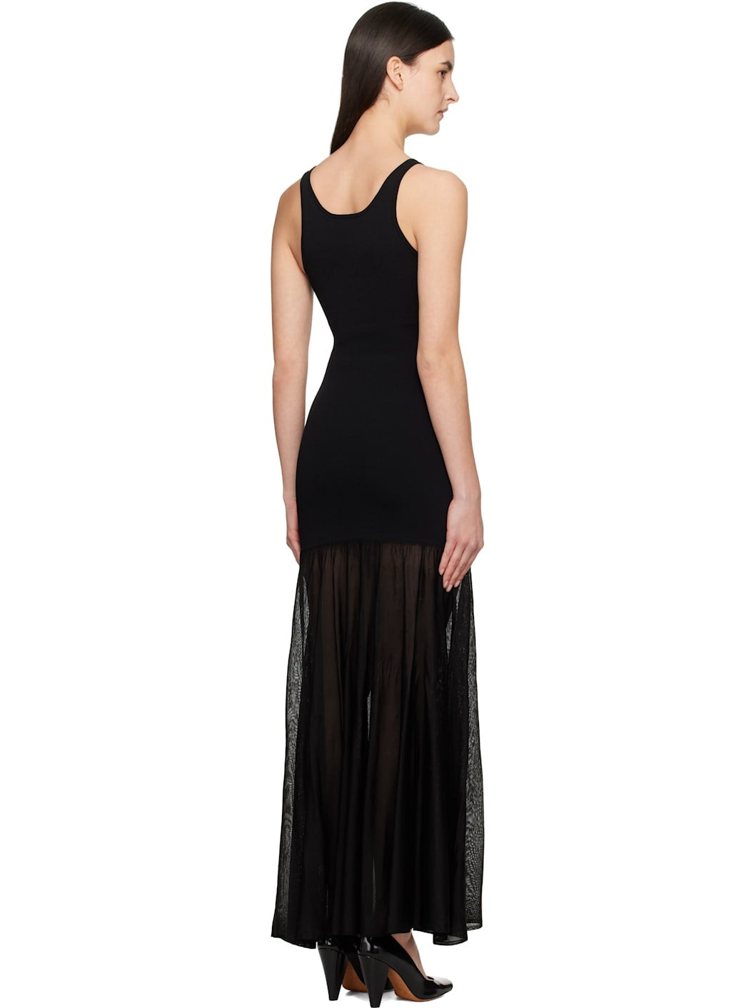 Elevate your evening style with this Black Evening Tank Maxi Dress by Toteme, crafted from a stretchy viscose-blend jersey combined with open-knit viscose for a flattering fit and breathable comfort. Its paneled construction and pleated skirt create graceful movement, while the rib-knit scoop neck and arms add subtle texture. Fixed shoulder straps ensure a secure fit, making this dress an elegant choice for any occasion where sophistication meets ease.