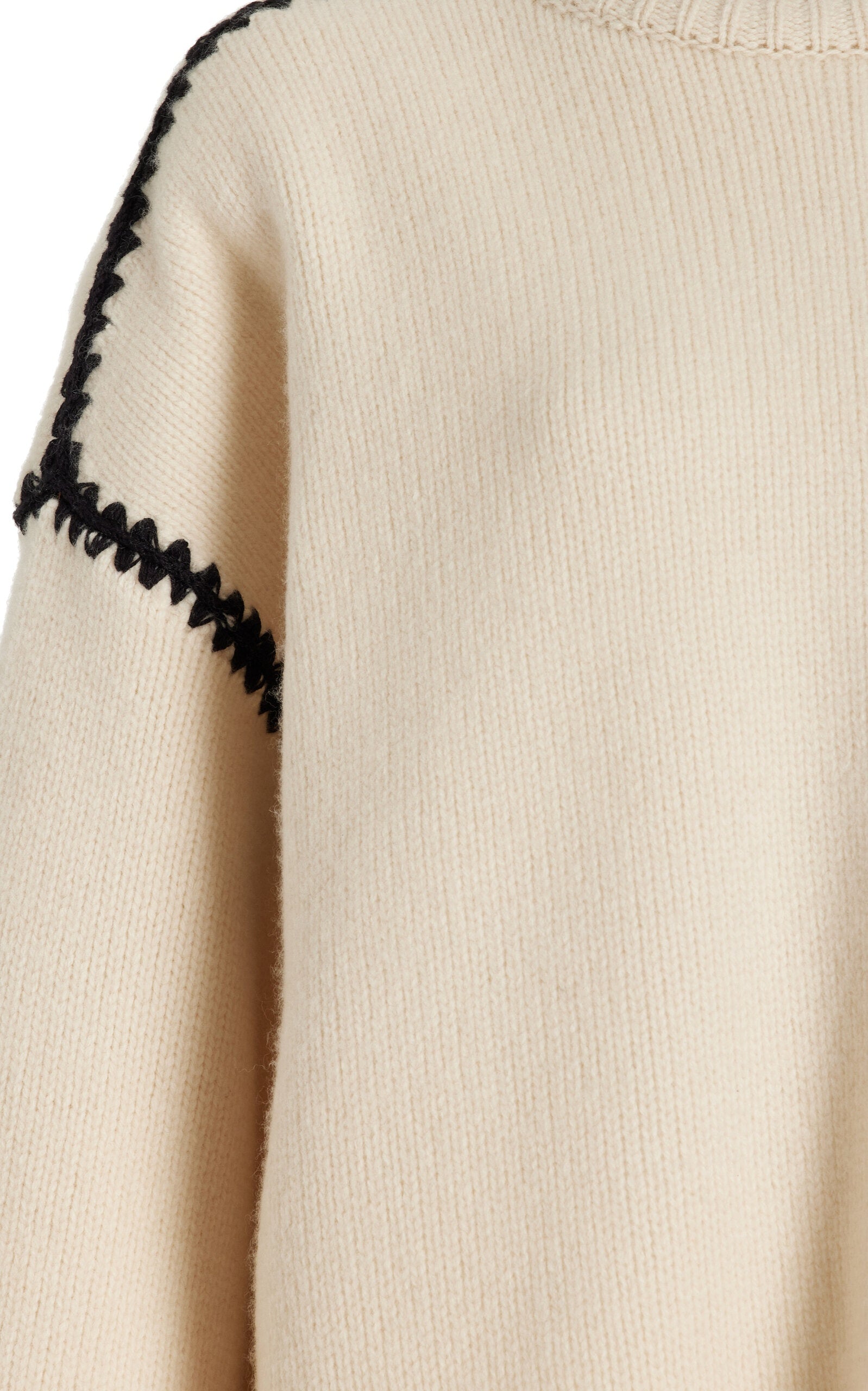 Embrace effortless Scandinavian style with this white wool-cashmere sweater by Totême. Crafted in a wide silhouette from mid-weight wool blended with cashmere, it offers cozy warmth and a soft touch. Intricate contrasting embroidery along the shoulders and armholes adds a refined, artisanal detail, elevating your everyday knitwear with subtle sophistication. Perfect for those who appreciate modern minimalism infused with a unique, handcrafted feel.