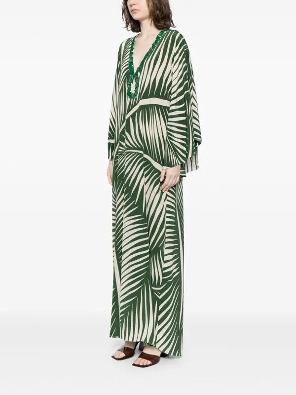 Escape to paradise with the Tropicanita Silk Dress, a sophisticated piece that brings tropical elegance to your everyday wardrobe. Crafted from luxurious silk, this dress features a striking white palm tree print that captures the essence of island living. The flattering V-neck with keyhole detail adds a touch of refinement, while long sleeves and a flowing straight hem create an effortlessly chic silhouette. Slip-on styling makes getting dressed a breeze. 