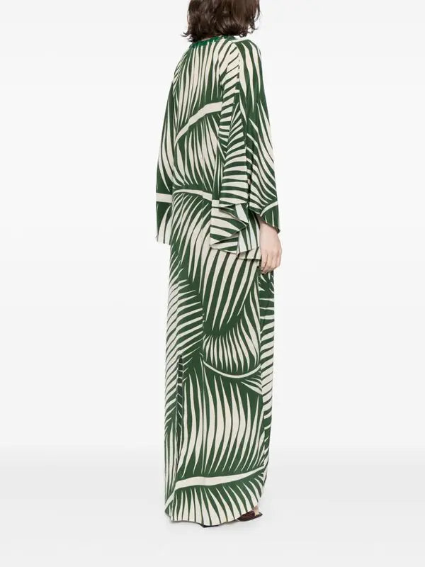 Escape to paradise with the Tropicanita Silk Dress, a sophisticated piece that brings tropical elegance to your everyday wardrobe. Crafted from luxurious silk, this dress features a striking white palm tree print that captures the essence of island living. The flattering V-neck with keyhole detail adds a touch of refinement, while long sleeves and a flowing straight hem create an effortlessly chic silhouette. Slip-on styling makes getting dressed a breeze. 