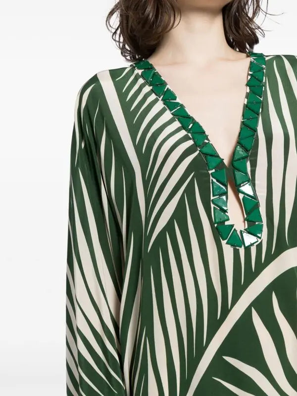 Escape to paradise with the Tropicanita Silk Dress, a sophisticated piece that brings tropical elegance to your everyday wardrobe. Crafted from luxurious silk, this dress features a striking white palm tree print that captures the essence of island living. The flattering V-neck with keyhole detail adds a touch of refinement, while long sleeves and a flowing straight hem create an effortlessly chic silhouette. Slip-on styling makes getting dressed a breeze. 