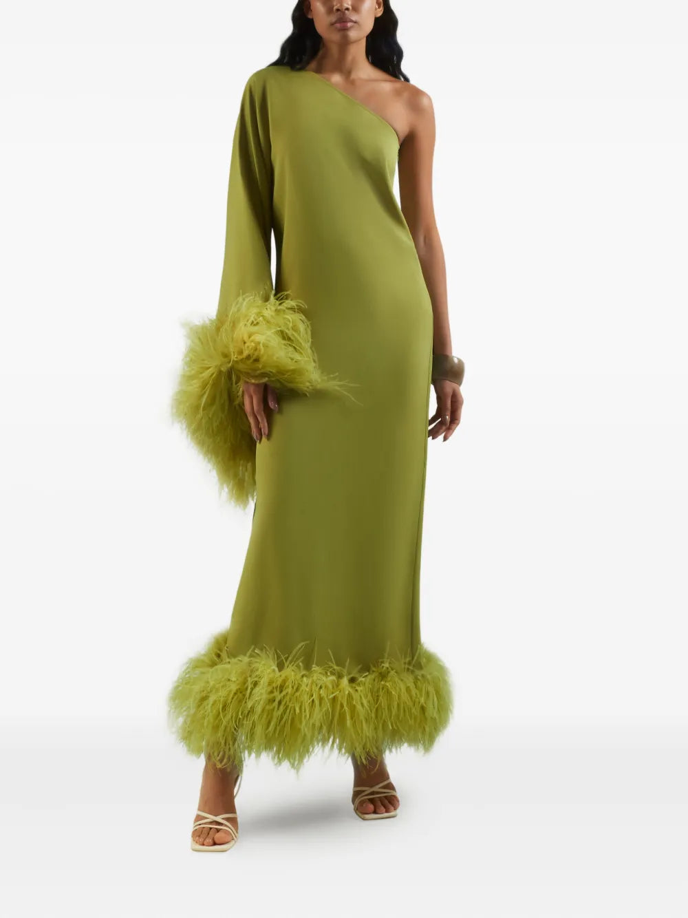 Elevate your style with the Baler Feather-trimmed One-shoulder Maxi Dress by Taller Marmo, crafted in Italy for exceptional quality. In a vibrant lime green, this floor-length gown features a striking one-shoulder neckline and an asymmetric sleeve adorned with delicate feather trim. Perfect for making a bold, elegant statement at any special occasion.