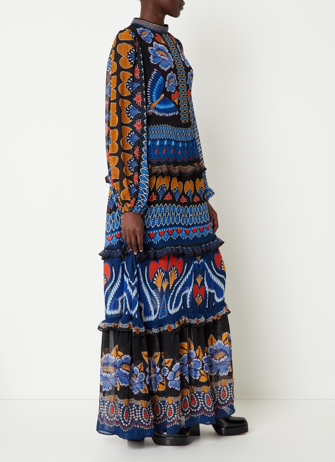 Elevate your wardrobe with the Anika Maxi Dress by Farm Rio, featuring vibrant prints and delicate ruffles that add a touch of feminine charm. The long sleeves provide coverage for cooler days while maintaining a flowy, elegant silhouette perfect for any occasion. This dress combines comfort and style effortlessly, making it an ideal choice for day-to-night wear. Transform your look with a splash of color and graceful movement in the Anika Maxi Dress.