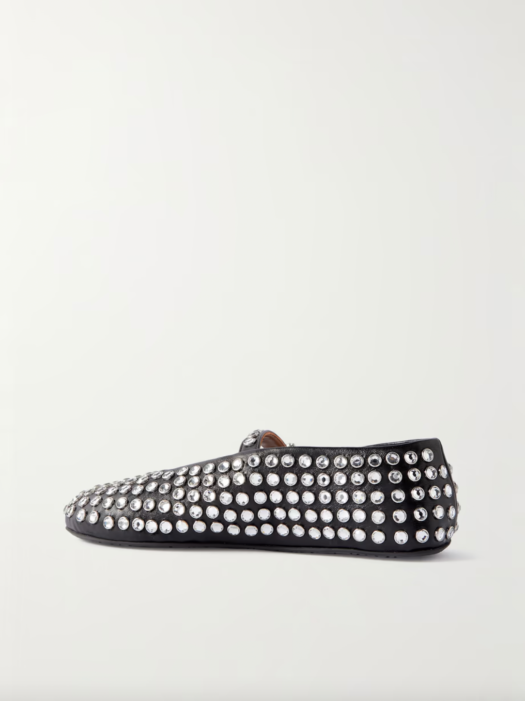 Transform any outfit into a showstopper with ALAÏA's crystal-embellished leather ballet flats. These luxurious and elegant flats add a touch of glamour to any occasion. Comfortable yet stylish, these flats are perfect for any fashion-forward individual. Elevate your wardrobe with these stunning ballet flats!