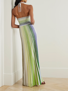 Missoni’s Sequin-embellished Metallic Crochet-knit Halterneck Maxi Dress elevates occasion dressing with vibrant style. Crafted in Italy with metallic threads, its vivid striped pattern catches the eye, while shimmering sequins add an elegant sparkle. The silver halterneck strap beautifully frames the collarbones, making this dress a stunning choice for any special event.