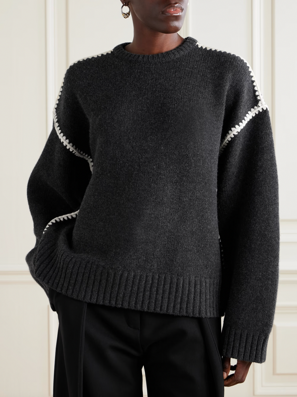 Elevate your wardrobe with this oversized sweater by Toteme crafted from a sumptuous wool and cashmere blend. Its relaxed fit with dropped shoulders offers effortless comfort, while the contrasting cream embroidery adds a refined, distinctive touch. Designed as a timeless staple, it seamlessly enriches your collection, providing both warmth and style for any occasion.