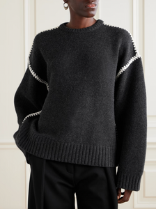 Elevate your wardrobe with this oversized sweater by Toteme crafted from a sumptuous wool and cashmere blend. Its relaxed fit with dropped shoulders offers effortless comfort, while the contrasting cream embroidery adds a refined, distinctive touch. Designed as a timeless staple, it seamlessly enriches your collection, providing both warmth and style for any occasion.
