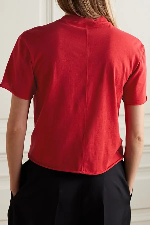The Fedrino Organic Cotton-jersey T-shirt by The Row offers timeless comfort with a soft, breathable fabric perfect for everyday wear. Its relaxed fit and dropped shoulders provide effortless style, while the slightly wider crewneck adds a modern touch. The subtle back seam enhances the streamlined look, making this tee a versatile staple you’ll turn to season after season. Available in a variety of colors to suit your personal style.