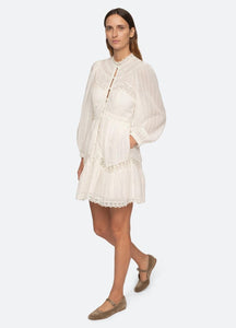 Stay comfortable and chic in the Haven Dress by Sea NY. Crafted from soft cotton, this dress features long puff sleeves, delicate lace insets, and trim detailing. Perfect for a day at the beach or a casual outing, it's a must-have for your wardrobe.