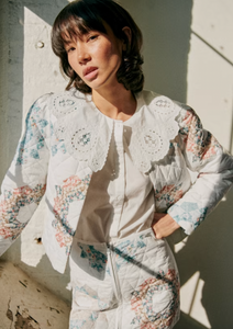 The Flavie Shirt by Sezane combines timeless elegance with a standout design featuring a large embroidered collar that adds a touch of sophistication to your look. Its long sleeves and buttoned front offer both comfort and versatility, making it perfect for dressing up or down. Elevate your wardrobe with this statement piece that effortlessly blends classic style and unique detail.