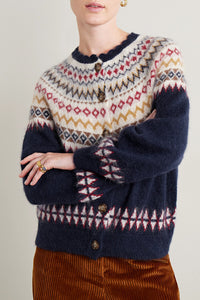 Introducing the Amble Cardigan by DÔEN. Made with a classic Fair Isle knit design, this cardigan provides both style and warmth. Perfect for any occasion, the Amble Cardigan is a versatile addition to any wardrobe.