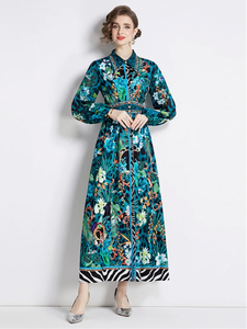 The Robe Nora is a trendy and elegant maxi dress, perfect for any occasion. Its soft green floral design adds a touch of femininity, while the turn down collar and long sleeves provide a sophisticated look. With the added feature of buttons, this dress is as functional as it is fashionable. Elevate your wardrobe with this versatile and stylish piece.