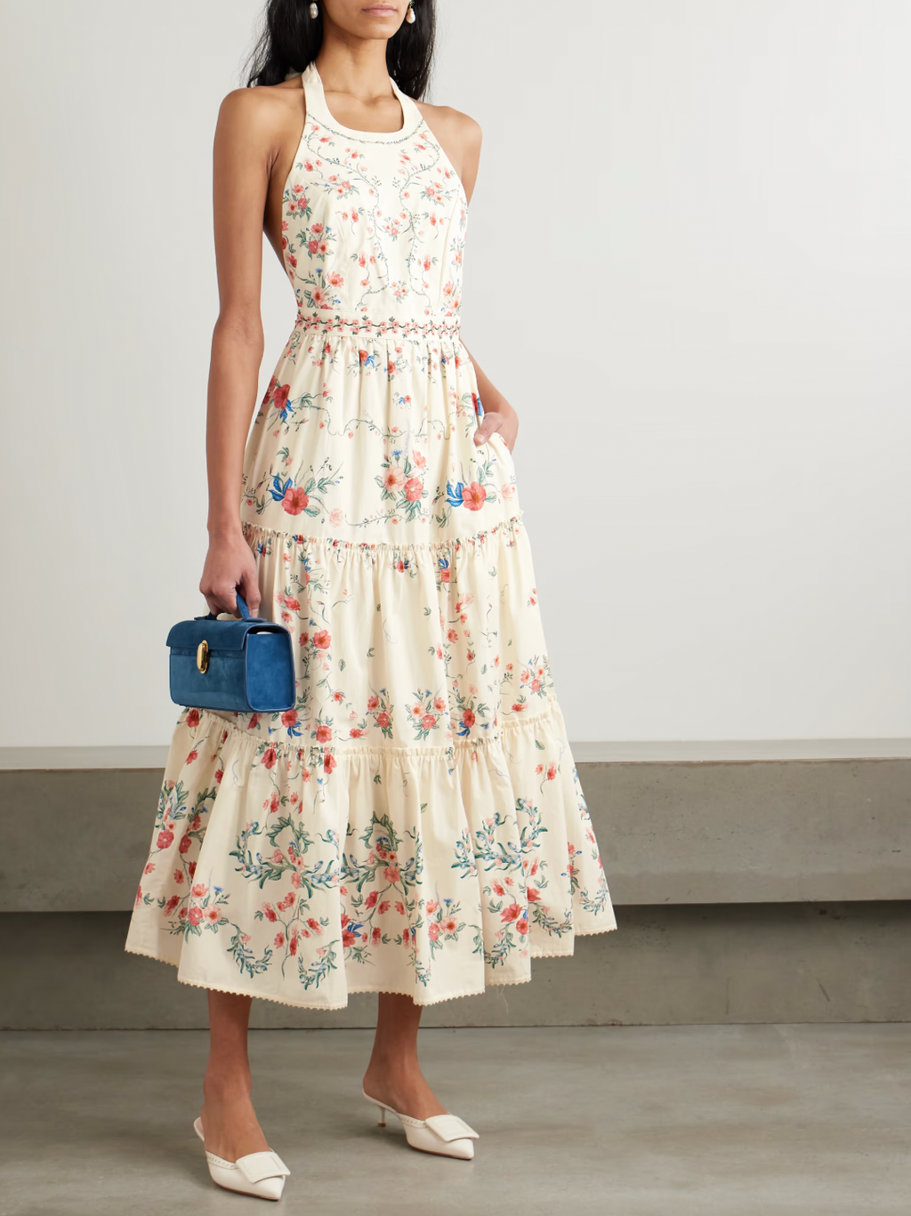 Crafted from breathable linen, the Consuelo Mosqueta Midi Dress from Agua by Agua Bendita features delicate embroidery of elegant blooms that enhance its refined aesthetic. Its flowing tiers offer effortless movement and a flattering silhouette, combining comfort with expert design that suits both casual and sophisticated occasions.