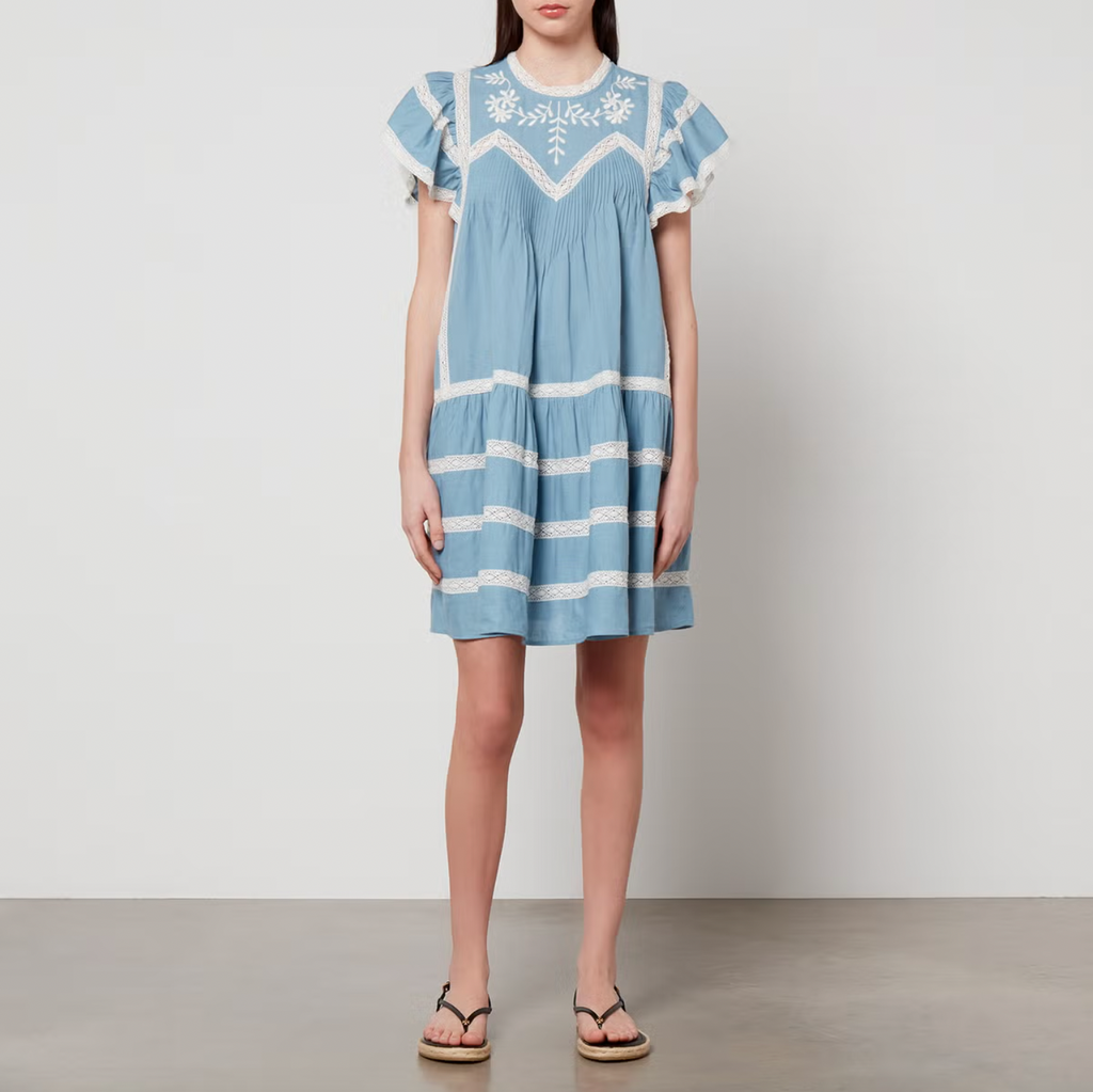 Indulge in the romantic charm of cottagecore with Sea New York's Kyla Linen Dress. Crafted in a luxurious linen-blend chambray, this A-line dress features delicate floral embroidery, flutter sleeves, and elegant pintucks and lace trims. A must-have for any stylish and sophisticated wardrobe.