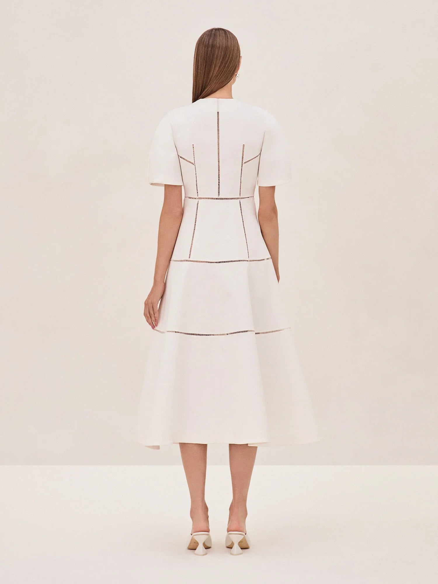 Indulge in effortless elegance with the Valry Dress by Alexis. Expertly crafted with clean lines and subtle stitched detailing, this dress exudes modern minimalism. The structured fit and flared skirt create a flattering silhouette while the zipper front adds a contemporary touch. Elevate your wardrobe with this exclusive piece.