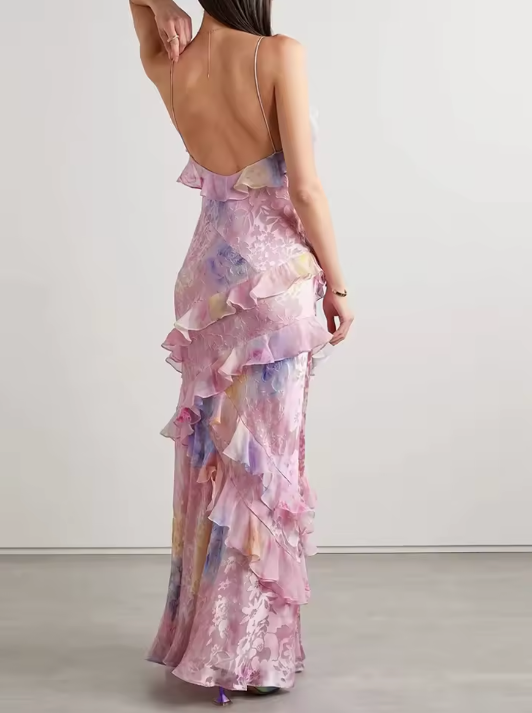 Introducing the Love Shack Fancy Rialto Dress. Made from crinkle burnout chiffon, this maxi dress is perfect for sunsets and dancing. With vibrant floral print and asymmetrical ruffles, it offers a unique and sexy silhouette. Plus, a side seam zipper ensures a perfect fit.