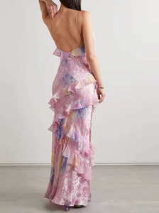 Introducing the Love Shack Fancy Rialto Dress. Made from crinkle burnout chiffon, this maxi dress is perfect for sunsets and dancing. With vibrant floral print and asymmetrical ruffles, it offers a unique and sexy silhouette. Plus, a side seam zipper ensures a perfect fit.