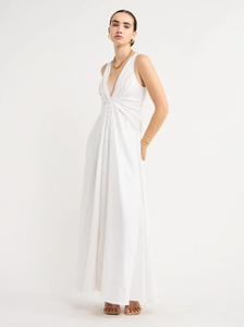 Adorn yourself with the elegance of the Sabrina Linen Maxi Dress in White. Crafted from Flax Linen fabrication for a relaxed easy fit, this maxi dress features a plunging neckline, a gathered twist front feature, functional linen-covered buttons, and a V-line open back with spaghetti tie fastening. With a graceful full skirt, this dress will be your go-to choice for summer getaways, birthday celebrations and refined holiday dressing.