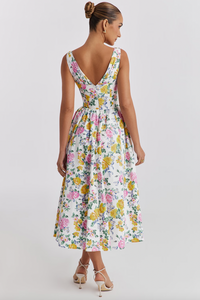 The 'Emelina' dress exudes effortless elegance with its blend of cotton-rich fabric and stretch, perfect for any occasion. The gathered bust and corseted waist create a flattering silhouette, while the midi skirt adds a feminine touch. The versatile white vintage rose print and convenient back zipper make it a go-to choice for any season.