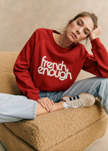 Stay comfy and stylish with this long-sleeved organic cotton sweatshirt. Show off your love for French culture with the "French Enough" print on the front, while staying cozy with the round neckline. Good for you and the environment.