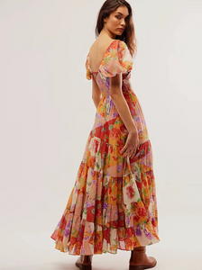 Embrace your inner goddess with our Sundrenched Short-Sleeve Maxi Dress! Featuring a dreamy mixed print, this ethereal dress flatters with its A-line shape, smocked bodice, and twist detail. The puffed sleeves add a touch of romance, making you stand out in any occasion.