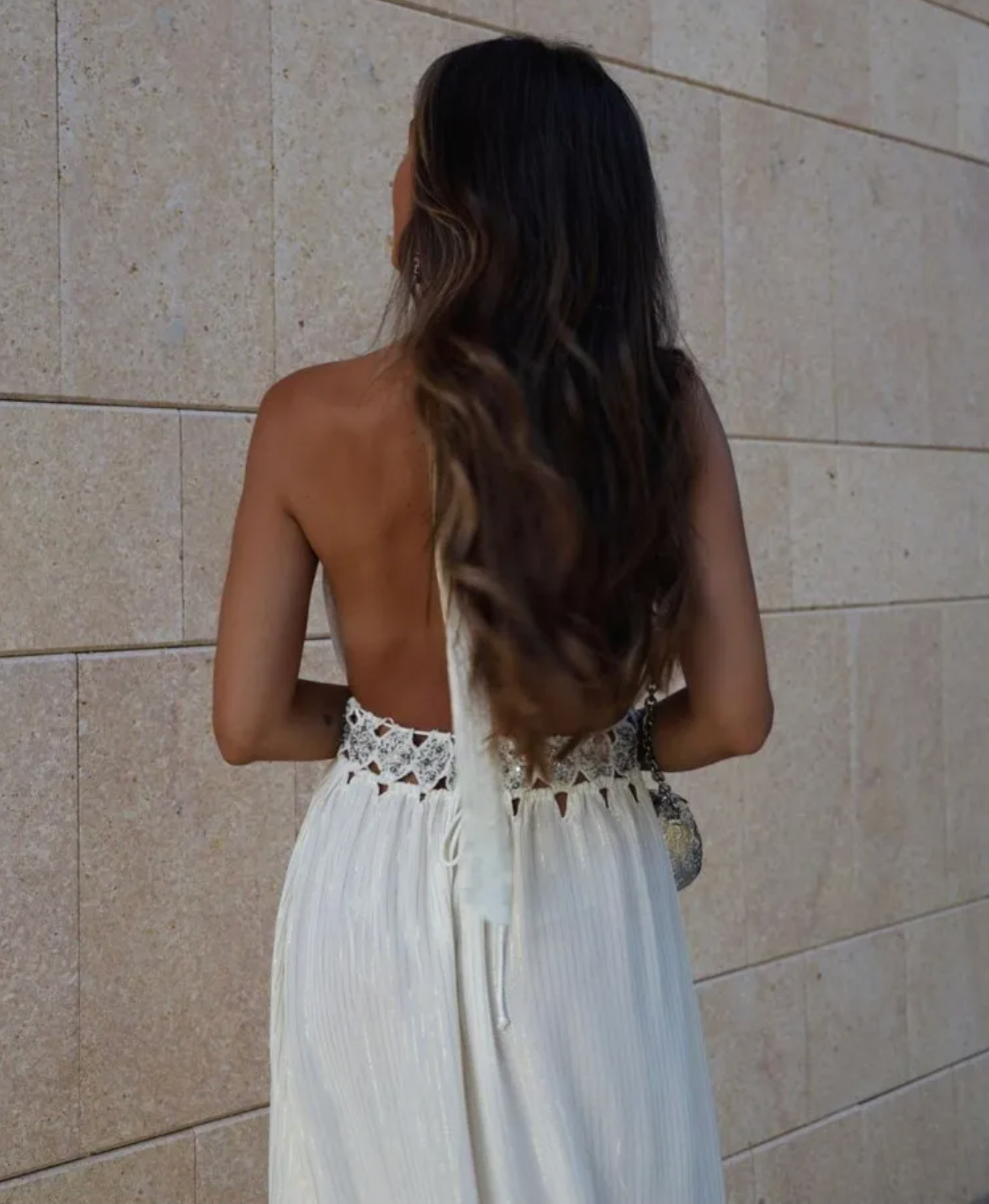 Indulge in the luxurious charm of our Rosalinda Dress. Made with cotton, this bohemian white dress features intricate sequin and pearl detailing. The sleeveless design and high waist create a flattering A-line silhouette, while the open back adds a touch of allure. Elevate your style with this dreamy, ethereal piece.