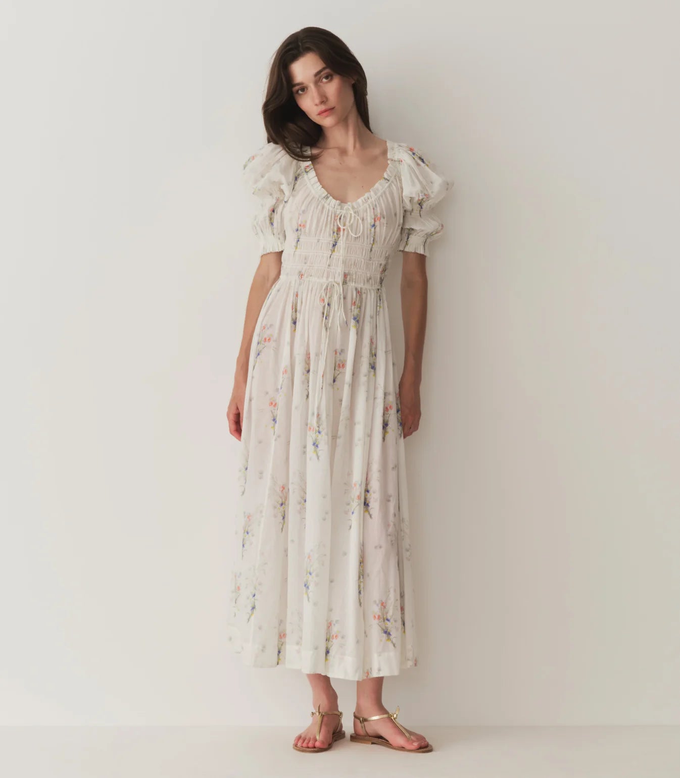 In a soft, lightweight organic cotton voile, the beloved Ischia Dress features double-puffed sleeves and a scoop neckline adorned with petite ruffles and a functional center tie. A smocked bodice with an adjustable waist tie gives way to an ankle-grazing A-line skirt. And, for the first time since we launched the style, we’re reintroducing the Ischia in its original print, a sweet Painted Bouquet floral.