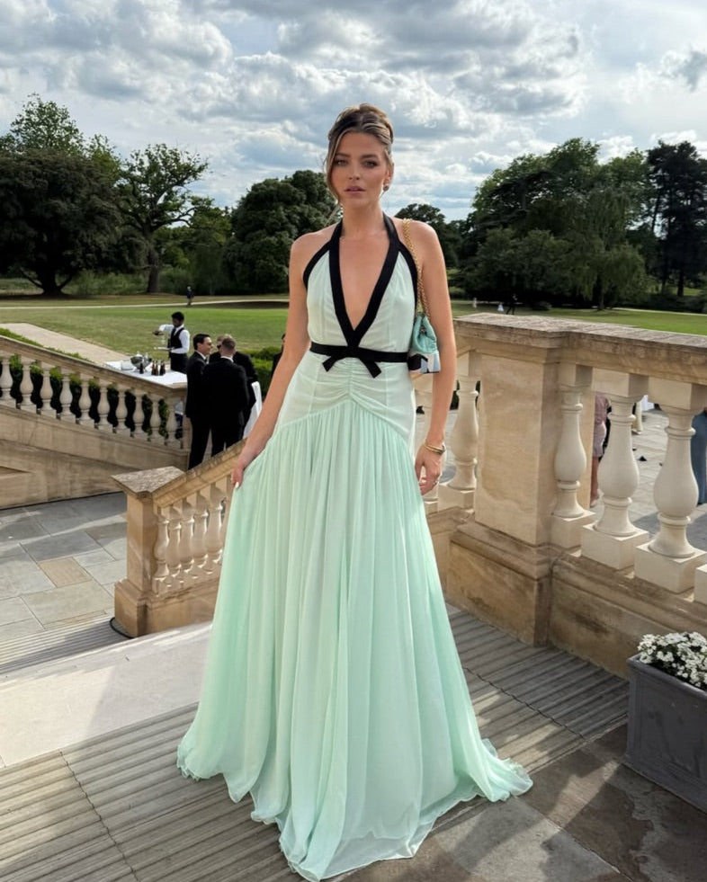 The Siren Dress in Mint by Helsa is engineered for those who embrace bold fashion statements. This sleeveless bodycon maxi features a striking plunging V-neckline and open back that exude confidence and allure. Contrast mesh patchwork adds contemporary visual interest, while pleated skirt detailing creates graceful movement. The secure halter construction delivers support without compromising the dress's daring aesthetic. 