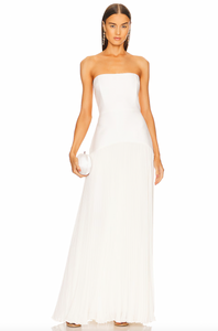 The Sunniva dress by Alexis is a timeless and sophisticated piece, perfect for any elegant occasion. Its strapless fit to flare design highlights your waist and flows into a pleated maxi skirt. Make a statement at any wedding, gala, or event with this stunning gown. Complete the look with drop earrings and a chic clutch.