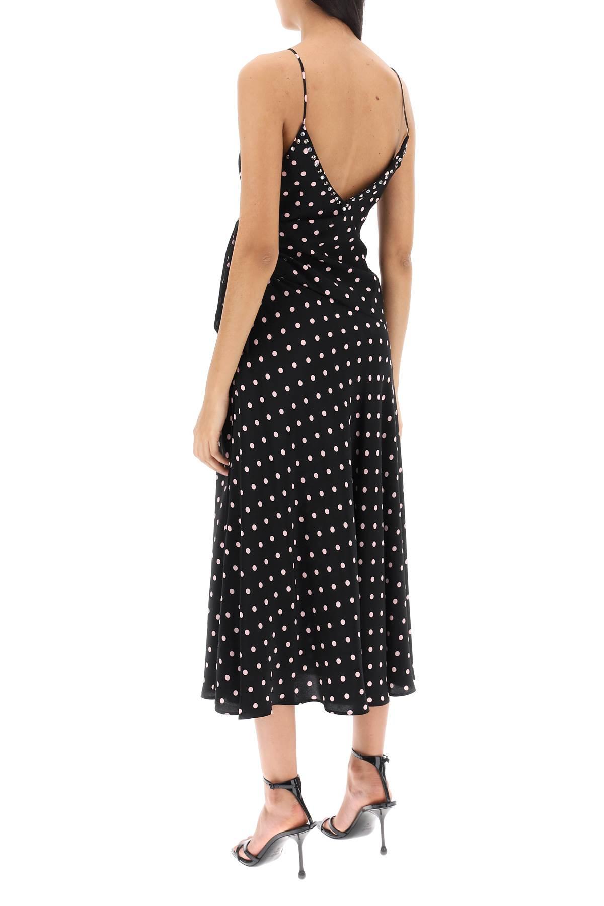 This high-quality designer slip dress, adorned with a playful polka dot print and finished with a delicate bow, is a top-of-the-line addition to any wardrobe. Handmade by industry experts, this Alessandra Rich dress offers a slinky, sophisticated silhouette perfect for any occasion.