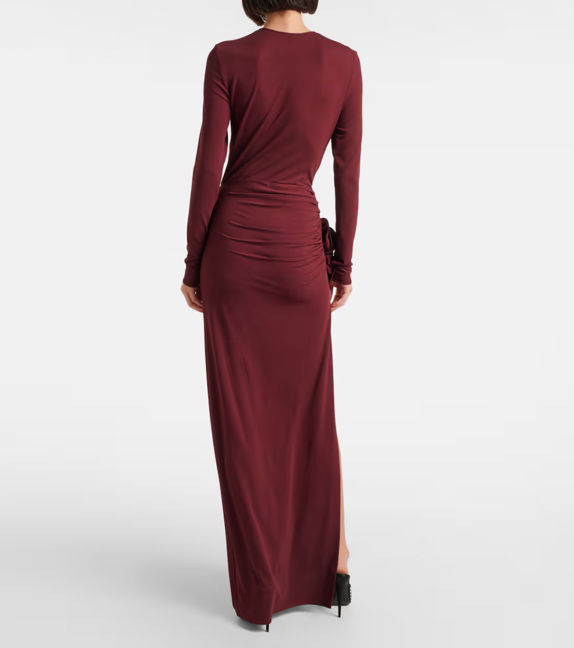 Indulge in this luxurious gown by Magda Butrym with delicate floral appliques and a figure-flattering ruched jersey fabric. Show off your sophisticated sense of style and radiate elegance at any special occasion. Elevate your look with this exclusive gown, perfect for the fashion and art lover in you.