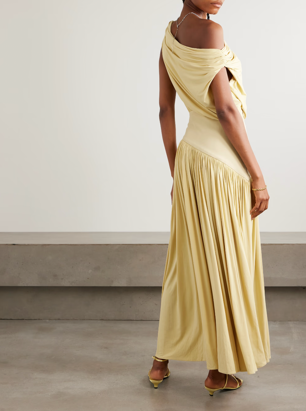 Discover effortless elegance with the Gwen Asymmetric Draped Jersey Dress by Abadia. Crafted from luxuriously soft stretch-bamboo fabric, this stunning piece features a sophisticated one-shoulder design that flatters every frame. Artfully draped details flow gracefully from the fitted top through the skirt, creating a silhouette that's both modern and timelessly chic. 