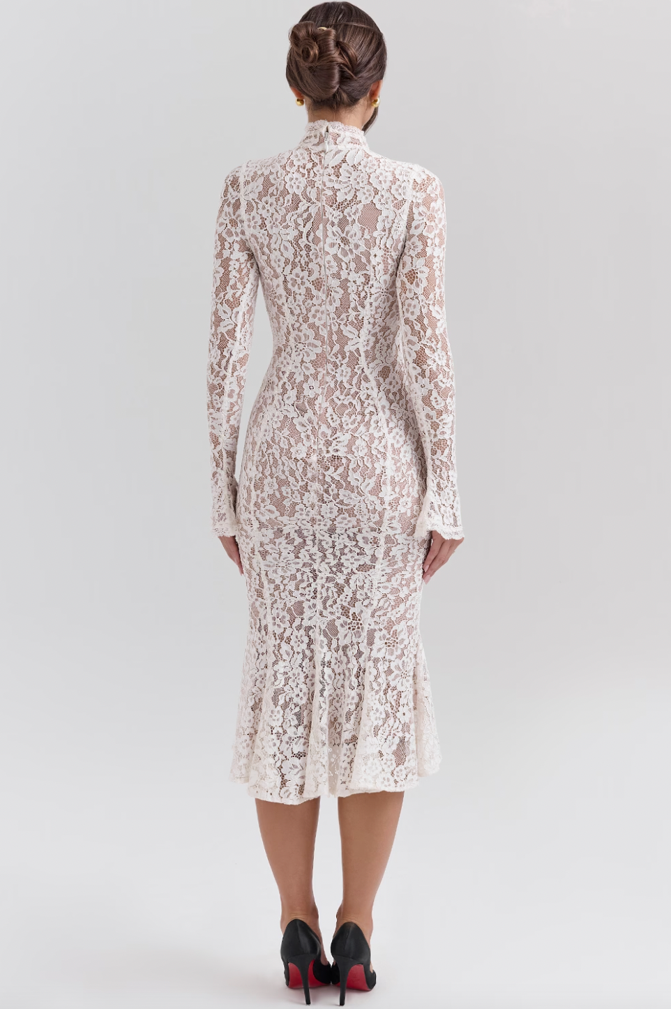 Get ready to turn heads with the Sophia Midi Dress. This dress combines modern flair and romantic elegance. Its body-hugging silhouette, high neck, and long sleeves beautifully highlight your shape while keeping it sophisticated. The ivory lace adds a touch of texture, and the fluted hem and cuffs add a playful twist to this timeless design.