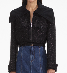 Indulge in opulence with the Tinsel Boucle Jacket. Drenched in black tinsel boucle, it boasts a cinched silhouette and elasticated waist. The perfect party piece, its oversized knitted collar pairs beautifully with our statement earrings. With a true-to-size fit and functional pockets, it's both chic and practical.