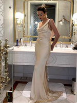 Load image into Gallery viewer, Introducing the Anja Satin Dress - a sleek and elegant sleeveless gown with a pleated V-neck and smooth, open back. The flowing silhouette and refined details make this dress perfect for any upscale event. Elevate your style with the Anja dress.
