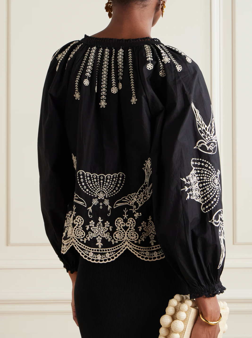 This Kingsley embroidered cotton-poplin blouse by SEA combines delicate craftsmanship with effortless style. Crafted from soft cotton-poplin, it features charming floral and bird embroidery alongside elegant swirling patterns. The loose fit enhances comfort, while scalloped edges and crocheted trims along the notched neckline add a touch of refined detail. Perfect for elevating any outfit with graceful ease.